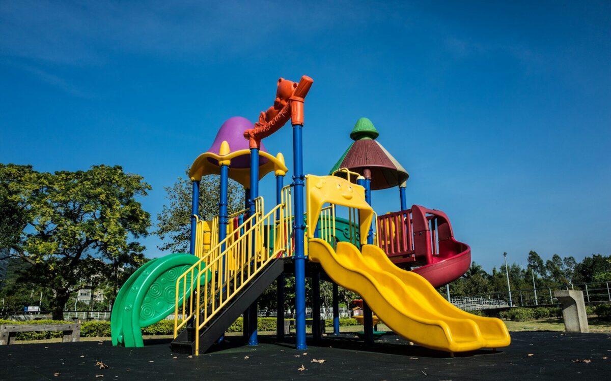 multicolored playground slide during daytime