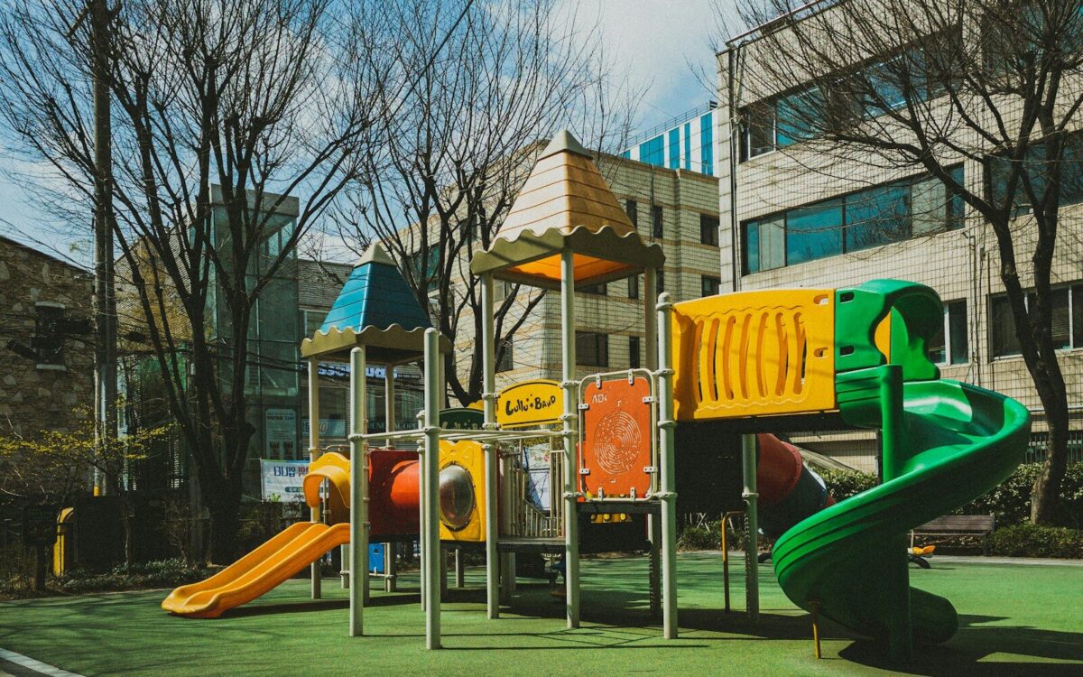 a children's play area in front of a building