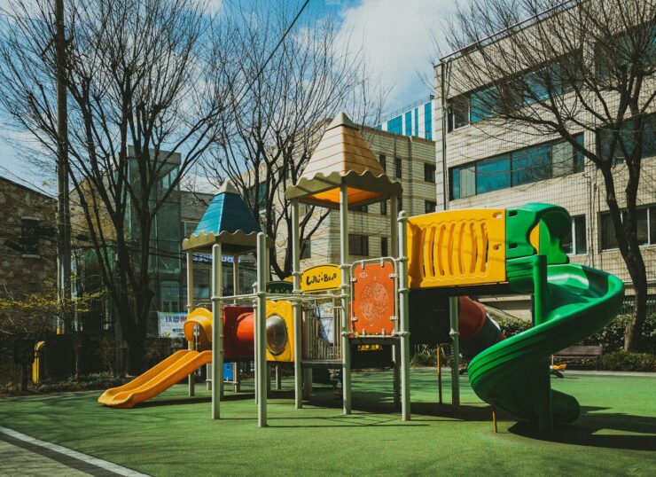 a children's play area in front of a building